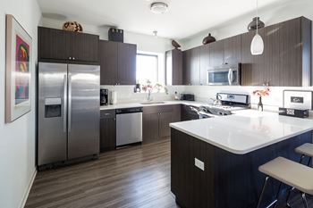 Form meets function. Gourmet kitchens with breakfast bars make cooking and entertaining a breeze